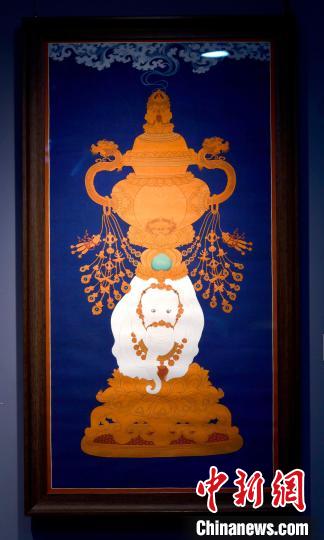 圖為5月16日，展覽中的新創(chuàng)唐卡作品《瑞象承香》?！±盍?攝